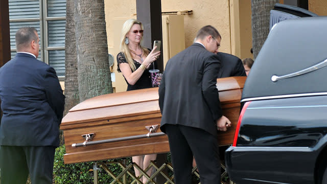 David and Jackie Siegel, subjects of the 2012 documentary <em>Queen of Versailles</em>, laid their 18-year-old daughter Victoria to rest on Tuesday after she was found unresponsive in the family's Florida home. Outside the service, Jackie Siegel was spotted holding a cellphone in what appeared to be images of her snapping photos of her daughter's casket as it was loaded into a hearse. Victoria's body was then taken to Woodlawn Cemetery in Gotha, Fla. where she was buried during a private service. Getty Images Victoria’s official obituary described her as a "down to earth hippie girl" and "an earthly angel with a sensitive nature and caring soul." The obit also detailed the teen’s long bucket list, which included skydiving, professional poker player, deep sea fishing, opening a campsite, and opening a sushi restaurant at the Cocoa Beach Pier. <strong> PHOTOS: Stars We've Lost </strong> The Siegel family addressed speculation and rumors surrounding Victoria’s death on Monday, in a statement saying, "Victoria had a history of seizures and was prescribed medication for this condition. Unfortunately she became dependent and struggled with this condition. She voluntarily underwent rehabilitation and was working hard to address this problem." Getty Images <strong> NEWS: Family Addresses Circumstances Surrounding Victoria Siegel's Death </strong> The Siegel family announced they were starting the Victoria Siegel Foundation, which "will be dedicated to helping troubled teens with addiction issues, similar to the Betty Ford Clinic." They asked that contributions to the foundation be made in lieu of flowers. 