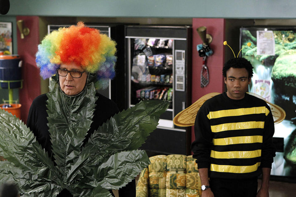 In a scene from the show, Chevy is in a plant costume with a clown wig, and Donald is dressed as a bumble bee