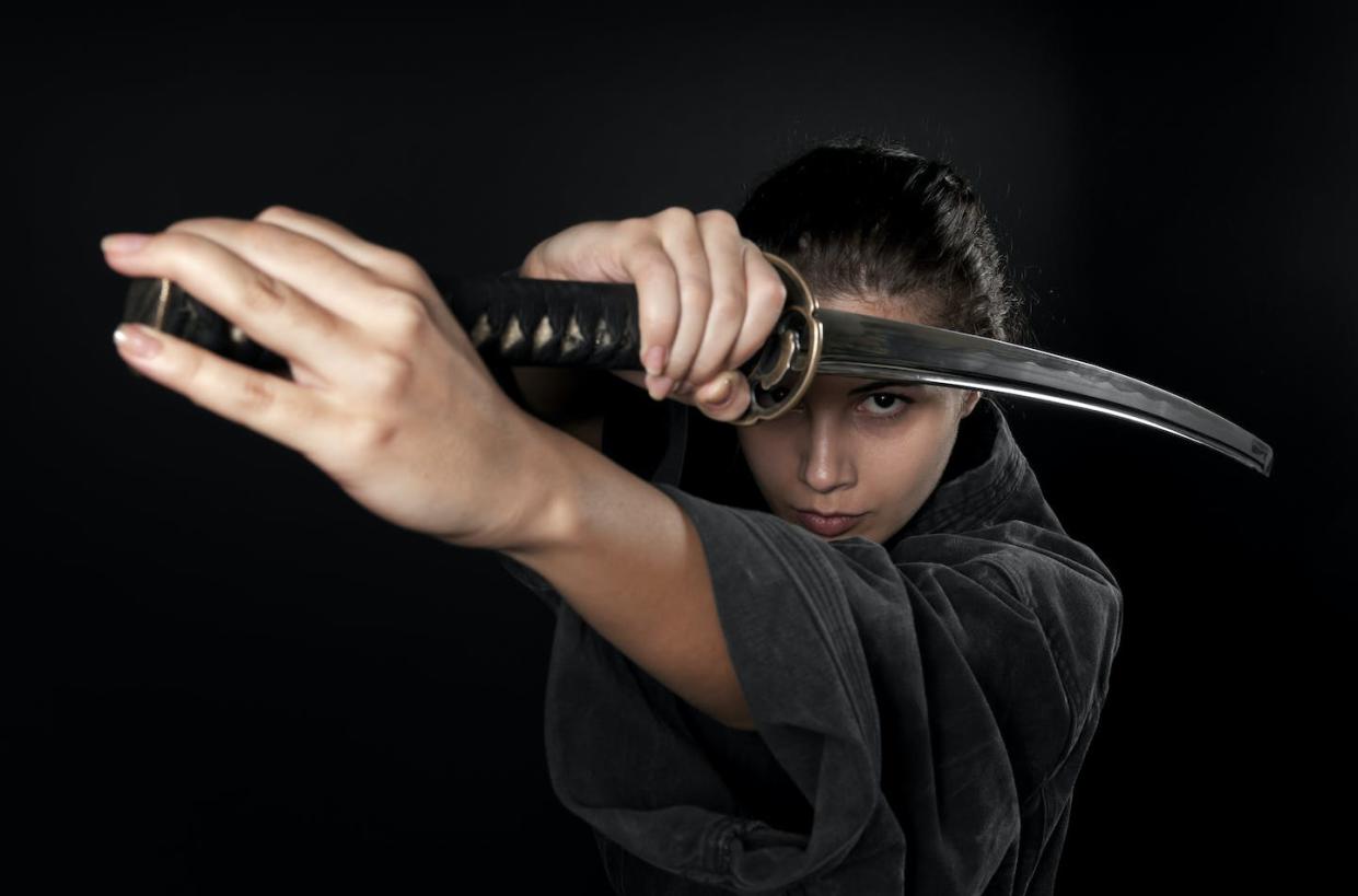 Can knowing how to handle a sword help in other areas of life? <a href="https://www.gettyimages.com/detail/photo/woman-with-katana-black-background-royalty-free-image/185056501?phrase=samurai+sword&adppopup=true" rel="nofollow noopener" target="_blank" data-ylk="slk:by_nicholas/E+ via Getty Images;elm:context_link;itc:0;sec:content-canvas" class="link ">by_nicholas/E+ via Getty Images</a>