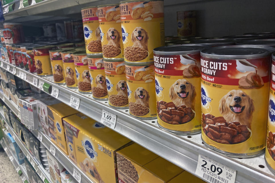 Various types of dog food are seen on display in a supermarket Tuesday, July 19, 2022, in Orlando, Fla. In 2018, the FDA began investigating whether the increasing popularity of grain-free dog foods had led to a sudden rise in a potentially fatal heart disease in dogs. Four years later, the FDA has reached no conclusion, but the publicity surrounding the issue has shrunk the once-promising market for grain-free dog foods. (AP Photo/John Raoux)