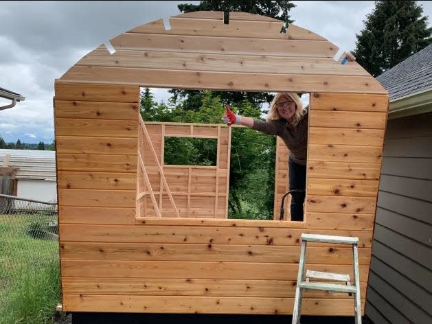 Fisher putting up the walls of the wagon