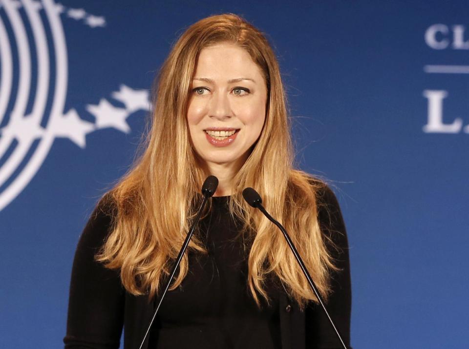 FILE - In a Dec. 9, 2013, file photo Chelsea Clinton speaks in Rio de Janeiro, Brazil. Chelsea Clinton says she and her husband are expecting their first child later this year. The daughter of former President Bill Clinton and former Secretary of State Hillary Rodham Clinton announced at a Clinton Foundation event in New York that she and her husband, Marc Mezvinsky, are "very excited" to be having their first child later this year. (AP Photo/Silvia Izquierdo, file)