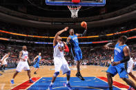 PHILADELPHIA, PA - APRIL 7: Dwight Howard #12 of the Orlando Magic grabs a rebound against Tony Battie #4 of the Philadelphia 76ers on April 7, 2012 at the Wells Fargo Center in Philadelphia, Pennsylvania. NOTE TO USER: User expressly acknowledges and agrees that, by downloading and/or using this Photograph, user is consenting to the terms and conditions of the Getty Images License Agreement. Mandatory Copyright Notice: Copyright 2012 NBAE