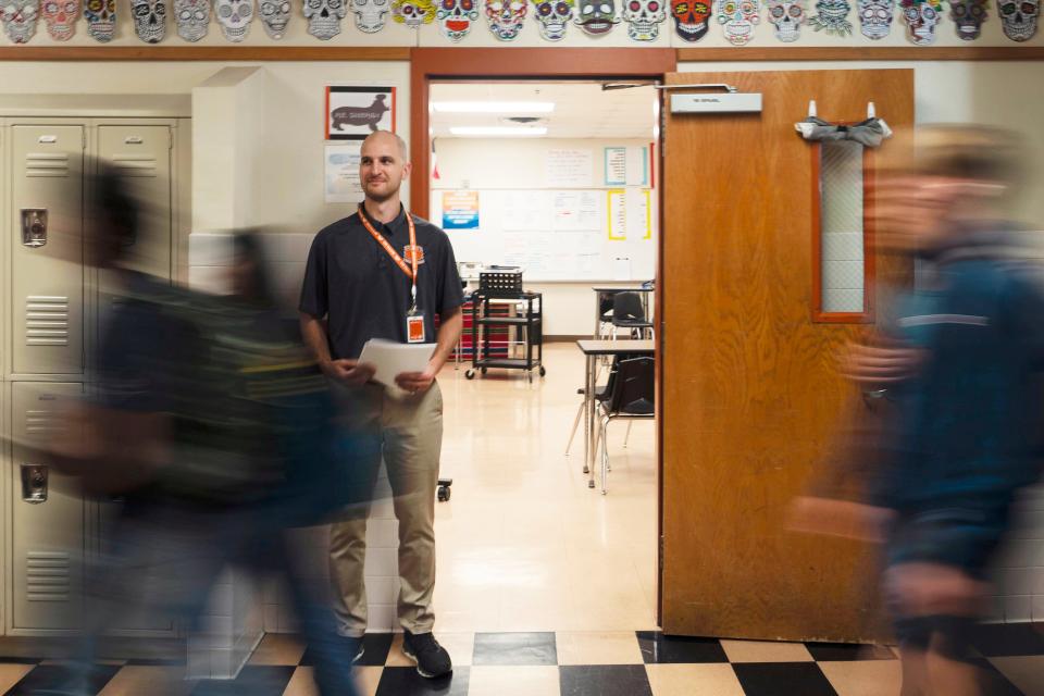 Students walk to class at Hutto High School last spring. The Hutto school district plans to launch a new program this fall to let new hires work for the district while they complete a bachelor's degree and teacher certification.