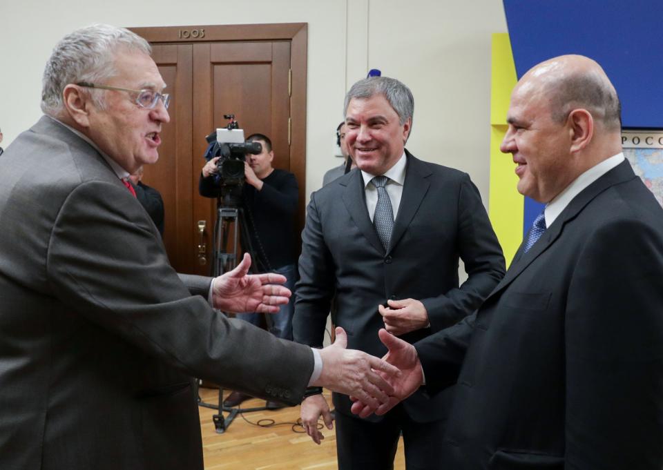 In this photo provided by The State Duma, The Federal Assembly of The Russian Federation, Russian Liberal Democratic Party leader Vladimir Zhirinovsky, left, greets Russian Tax Service chief Mikhail Mishustin, right, who was nominated to replace Medvedev, as Russian State Duma speaker Vyacheslav Volodin stands next during their meeting in the State Duma, the Lower House of the Russian Parliament in Moscow, Russia, Thursday, Jan. 16, 2020. Russian President Vladimir Putin has named tax service chief Mikhail Mishustin as Russia's new prime minister. (The State Duma, The Federal Assembly of The Russian Federation via AP)