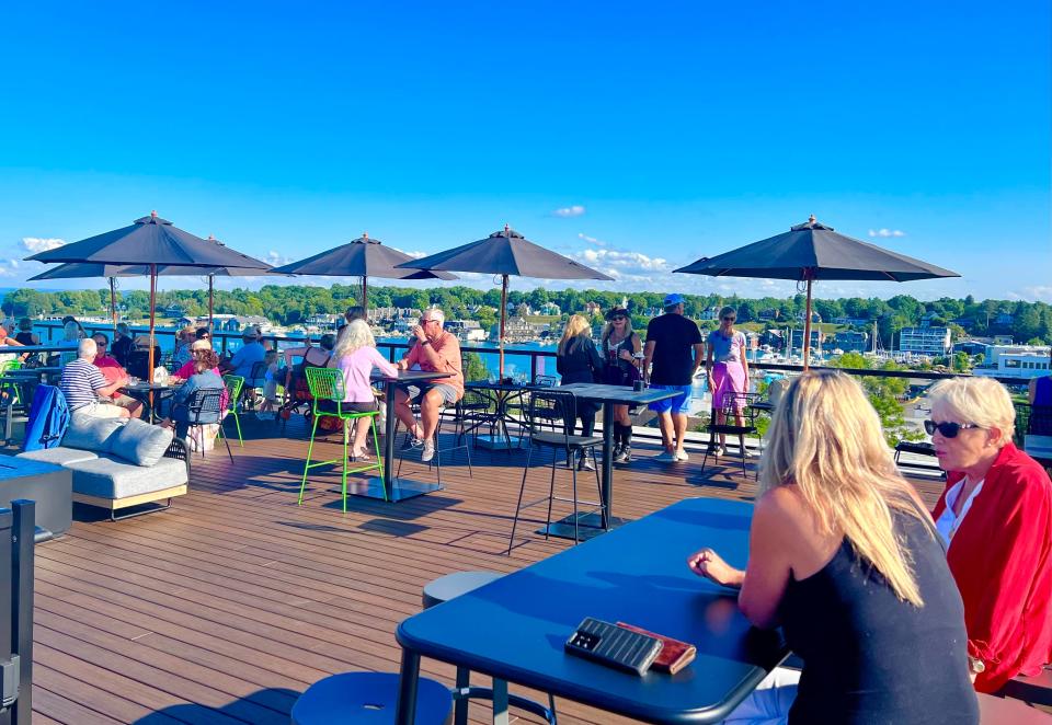 People gather on Hotel Earl's rooftop for drinks and live music on Aug. 10.