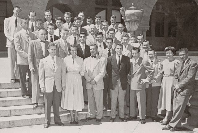 <p>Bettmann Archive</p> Sandra Day O'Connor (first row, second from left) poses in a class photograph. Future Chief Justice William Rehnquist stands in the back row, farthest to the left