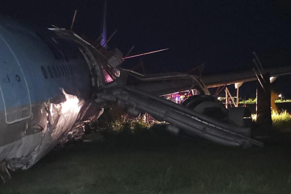 In this photo provided by the Civil Aviation Authority of the Philippines, a damaged portion of the Korean Air Lines Co. plane lies after it overshot the runway at the Mactan Cebu International Airport in Cebu, central Philippines, on Monday, Oct. 24, 2022. A Korean Air Lines Co. plane overshot a runway while landing in bad weather in the central Philippines late Sunday and authorities said all those on board were safe. The airport is temporarily closed due to the stalled aircraft. (Civil Aviation Authority of the Philippines via AP)