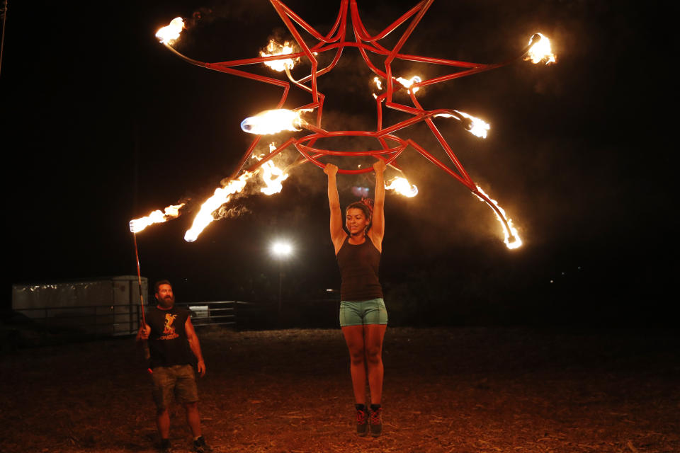 Bayleigh Solorzano practices an aerial routine for "Gladius The Show," a touring equestrian and acrobatic show, Thursday, May 28, 2020, in Las Vegas. The coronavirus forced the producers to cancel all of their performances through 2020. (AP Photo/John Locher)