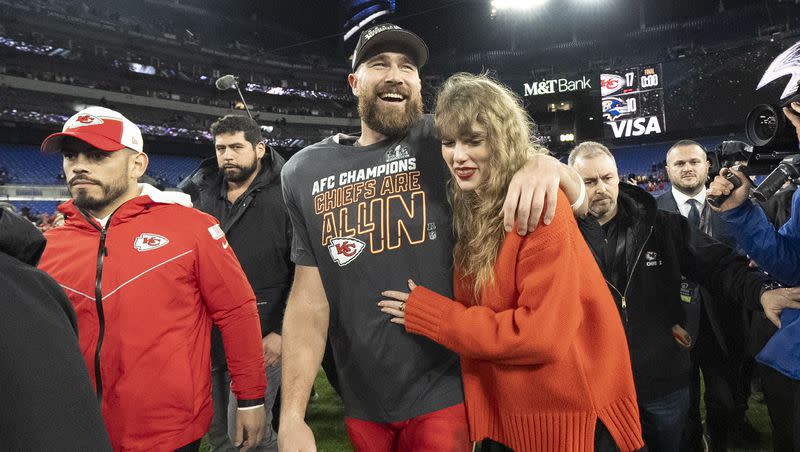 Kansas City Chiefs tight end Travis Kelce and Taylor Swift walk together after the AFC Championship game between the Chiefs and the Baltimore Ravens on Jan. 28, 2024, in Baltimore. 