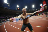 Germany's Robert Harting celebrates after winning the men's discus throw final during the London 2012 Olympic Games at the Olympic Stadium August 7, 2012. Harting won gold ahead of Iran's Ehsan Hadadi who took silver and Estonia's Gerd Kanter who won bronze. REUTERS/Kai Pfaffenbach (BRITAIN - Tags: SPORT ATHLETICS OLYMPICS TPX IMAGES OF THE DAY)