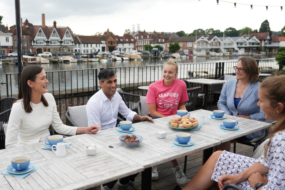 Prime Minister Rishi Sunak and Caroline Newton, second right, Henley and Thame constituency parliamentary candidate, visit Leander Rowing Club as he campaigns in Henley-on-Thames, England (AP)