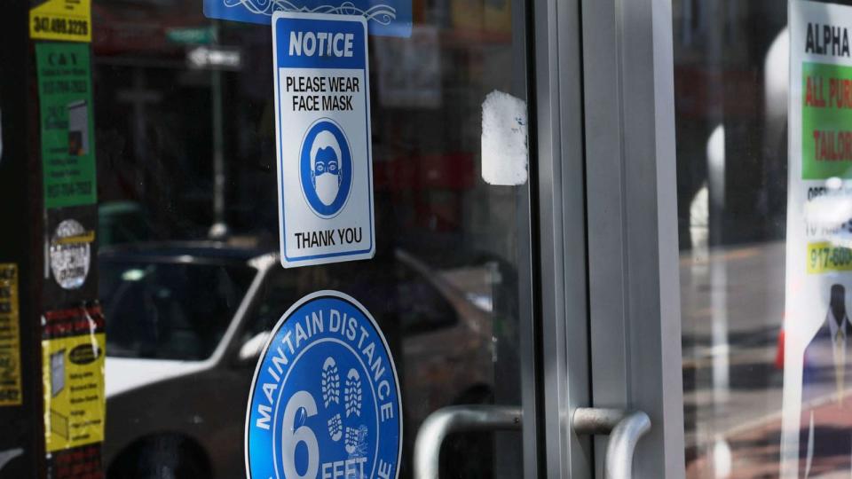 PHOTO: A mask-required sign is seen on a door of a store on Sept. 1, 2023 in the Brooklyn borough in New York City (Michael M. Santiago/Getty Images)