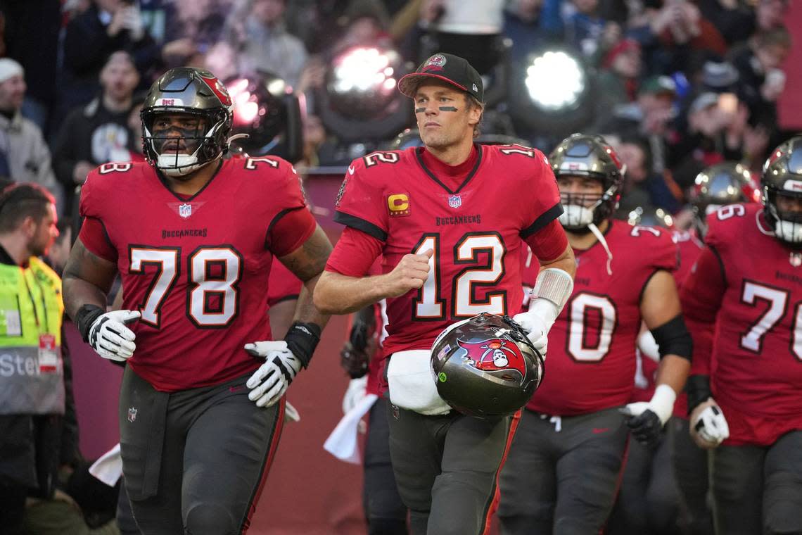 Tampa Bay Buccaneers quarterback Tom Brady (12) runs onto the field before an NFL football game against the Seattle Seahawks, Sunday, Nov. 13, 2022, in Munich, Germany. (AP Photo/Matthias Schrader)