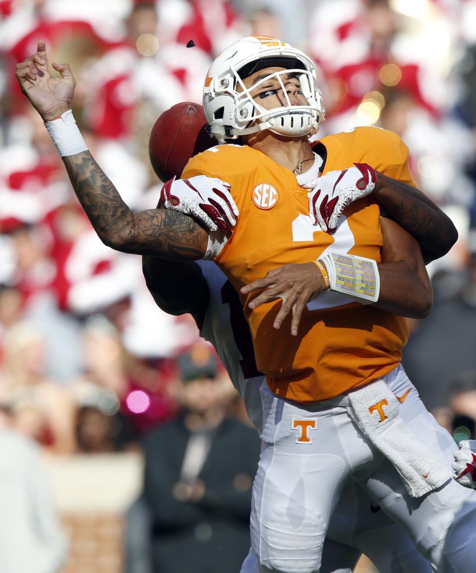 Tennessee quarterback Jarrett Guarantano (2) fumbles the ball as he's hit by Alabama defensive back Xavier McKinney (15) in the first half of an NCAA college football game against Alabama Saturday, Oct. 20, 2018, in Knoxville, Tenn. (AP Photo/Wade Payne)