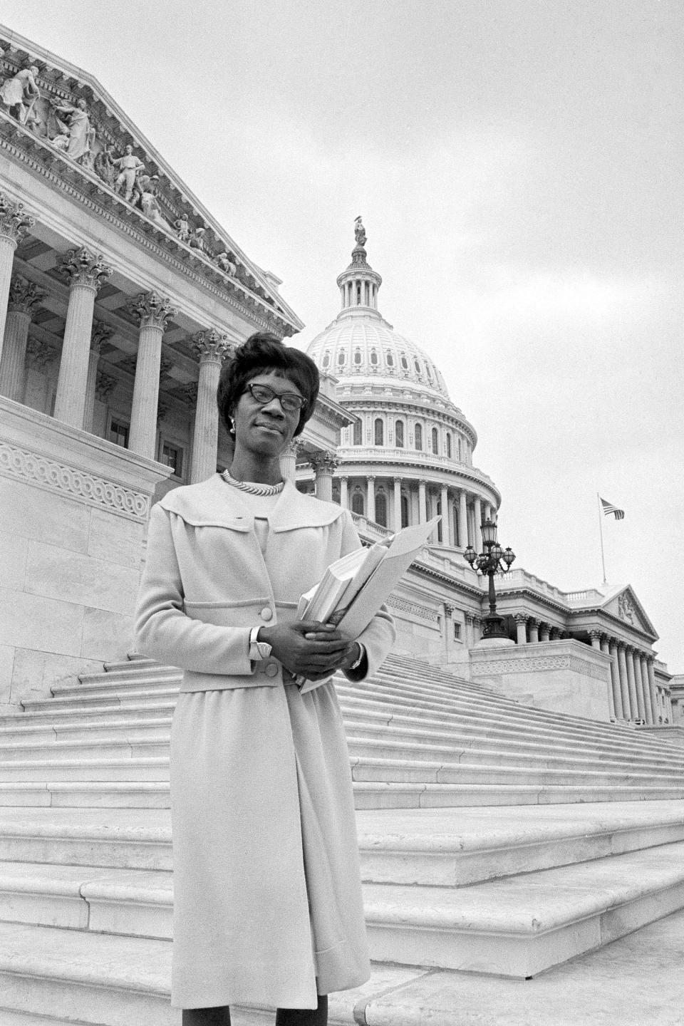 FILE - Rep. Shirley Chisholm D-N.Y., poses on the steps of the Capitol in Washington, March 26, 1969. The arrival of Title IX and its protections for American women was a long time coming and the result of hard work from the likes of Jeannette Rankin, Shirley Chisholm, Eleanor Roosevelt, Patsy Mink and more. (AP Photo/Charles Gorry, File)