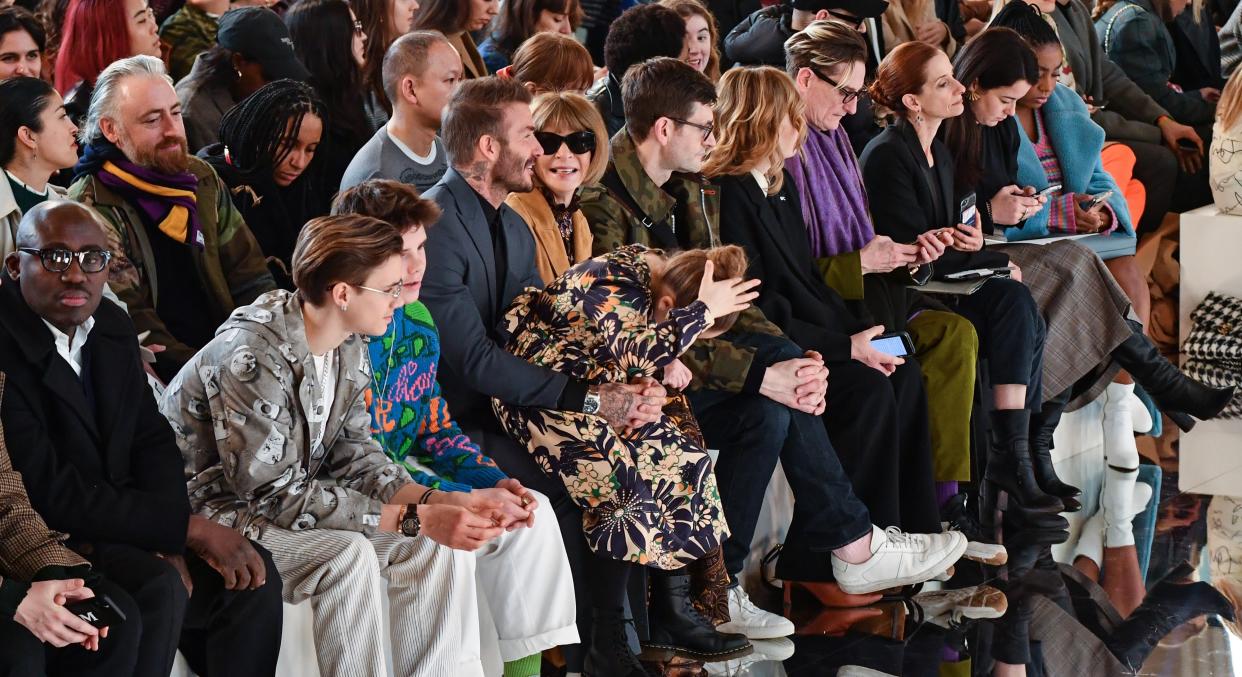 Victoria Beckham was supported by her family on the front row at London Fashion Week. (Photo: Getty)