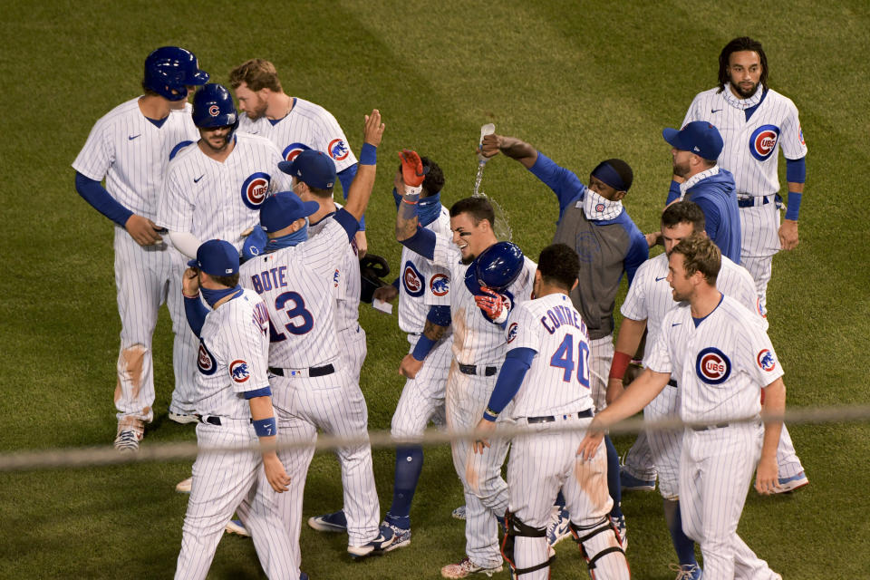 The Chicago Cubs celebrate a 3-2 win over the Cleveland Indians in the 10th inning of a baseball game Wednesday, Sept. 16, 2020, in Chicago. (AP Photo/Mark Black)