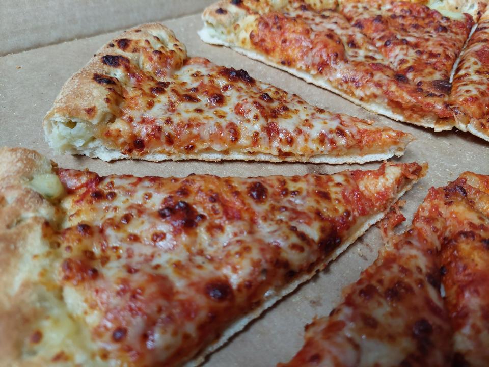 Slices of pizza from Papa John's, displayed in a box