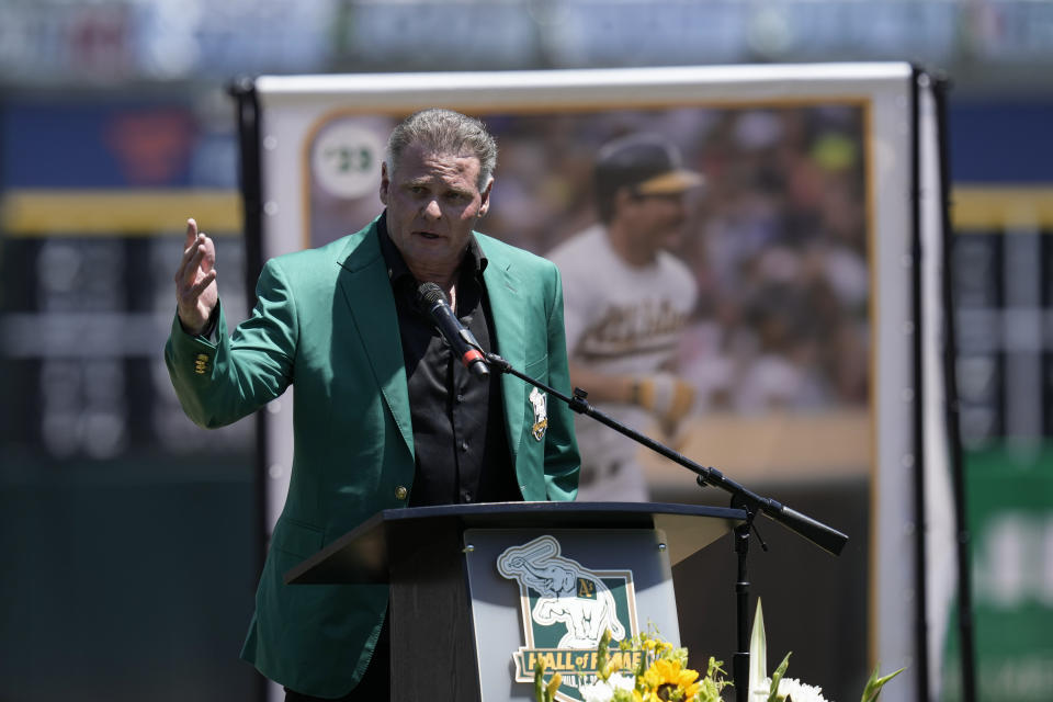 Jason Giambi speaks to the crowd after being inducted in the Oakland Athletics' Hall of Fame before the team's baseball game against the San Francisco Giants, Sunday, Aug. 6, 2023, in Oakland, Calif. (AP Photo/Godofredo A. Vásquez)