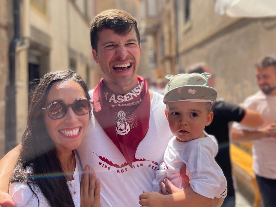 Couple with baby on a street in Spain