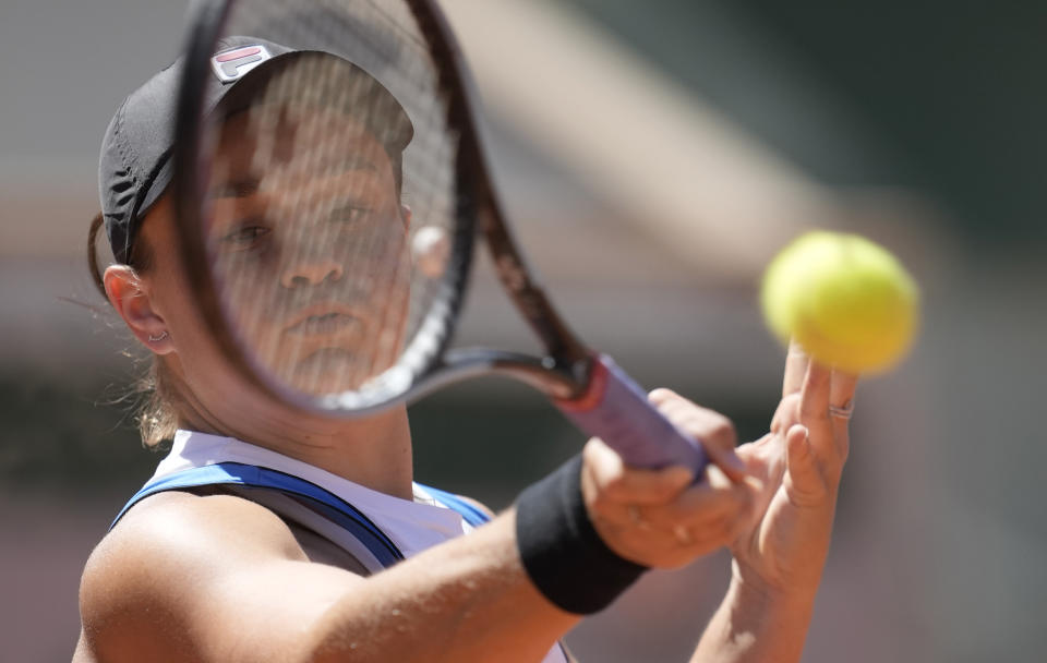 Australia's Ashleigh Barty plays a return to United States's Bernarda Pera during their first round match on day three of the French Open tennis tournament at Roland Garros in Paris, France, Tuesday, June 1, 2021. (AP Photo/Christophe Ena)