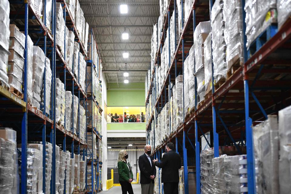 President Joe Biden and first lady Jill Biden with Houston Food Bank CEO Brian Greene, visit the Houston Food Bank in Houston, Texas, on February 26, 2021.