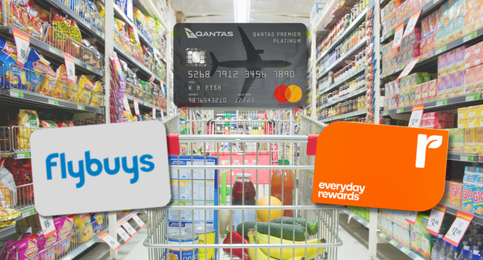 Flybuys, Everyday Rewards and Qantas Premier Platinum cards on a background of a shopping trolley in a supermarket aisle.