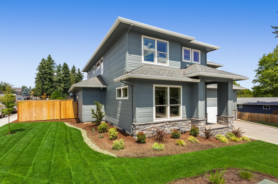 Facade of home with manicured lawn