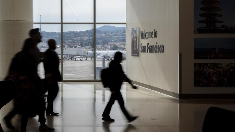 PHOTO: Travelers arrive at San Francisco International Airport (SFO) in San Francisco, Dec. 21, 2023. (David Paul Morris/Bloomberg via Getty Images, FILE)