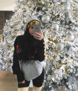 <p>Kylie Jenner, 19, snapped a pouty selfie with her enormous snow-flocked tree. (Photo: Instagram) </p>