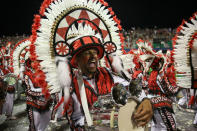 <p>A drummer from the Mancha Verde samba school performs during a carnival parade in Sao Paulo, Brazil, Saturday, Feb. 10, 2018. (Photo: Andre Penner/AP) </p>