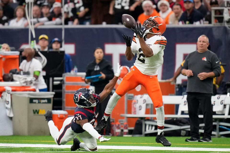 Cleveland Browns wide receiver Amari Cooper (2) hauls in a pass for a touchdown as Houston Texans cornerback D'Angelo Ross (37) defends Dec. 24, 2023, in Houston.