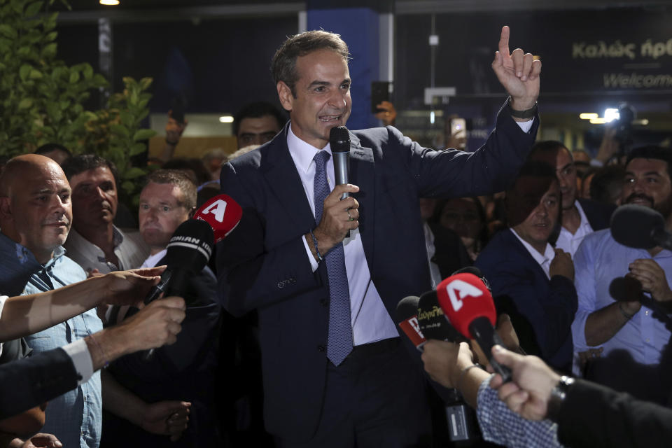 Greek opposition New Democracy conservative party leader Kyriakos Mitsotakis talks to his supporters at the New Democracy headquarters in Athens, on Sunday, July 7, 2019. Official results from nearly 60% of ballots counted showed the conservative New Democracy party of Kyriakos Mitsotakis winning comfortably with 39.7% compared to Tsipras' Syriza party with 31.5%. (AP Photo/Petros Giannakouris)