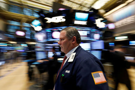 Traders work on the floor of the New York Stock Exchange (NYSE) in New York, U.S., February 7, 2017. REUTERS/Brendan McDermid