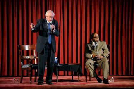 Democratic U.S. presidential candidate Bernie Sanders (L) speaks at an African American Community Conversation town hall event with Rev. Robert Johnson at Tindley Temple United Methodist Church in Philadelphia, Pennsylvania April 6, 2016. REUTERS/Mark Kauzlarich