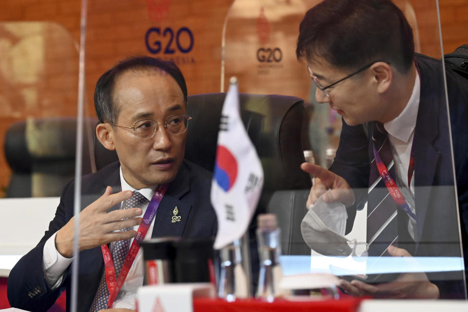 South Korean Finance Minister Choo Kyung-ho talks to a delegate member as he attends the second day of the G20 Finance Ministers and Central Bank Governors Meeting in Nusa Dua,Bali, Indonesia, on Saturday, July 16, 2022. (Sonny Tumbelaka/Pool Photo via AP)