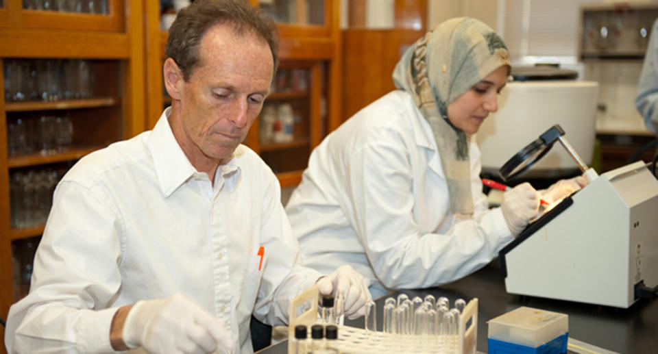 Professor Paul Dawson (left) works in the lab alongside a student. Source: Clemson University