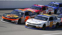 Noah Gragson (9), AJ Allmendinger (16) and Sammy Smith (18) race during the New Holland 250 NASCAR Xfinity Series auto race at the Michigan International Speedway in Brooklyn, Mich., Saturday, Aug. 6, 2022. (AP Photo/Paul Sancya)