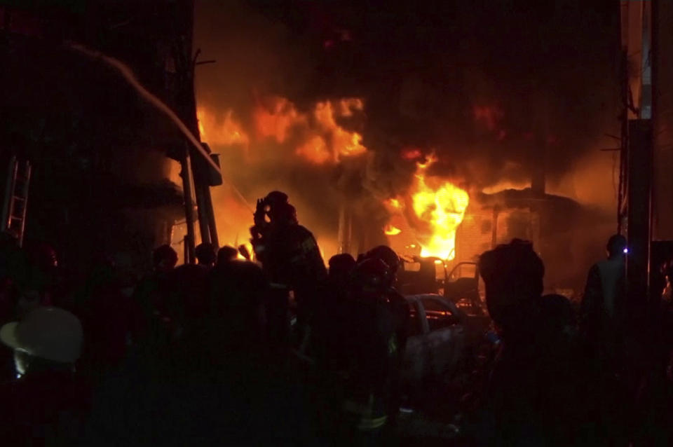 In this image made from a video, firefighters try to extinguish flames at buildings in Dhaka, Bangladesh, Feb. 20, 2019. A devastating fire has raced through buildings in an old part of Bangladesh's capital, causing casualties. (Photo: AP)