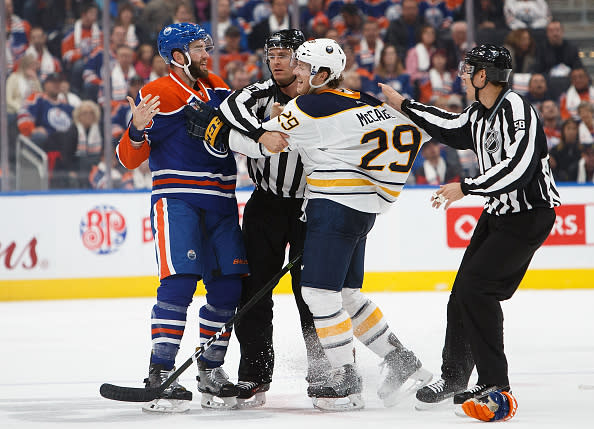 EDMONTON, AB - OCTOBER 16: Eric Gryba #62 of the Edmonton Oilers drops the gloves with Jake McCabe #29 of the Buffalo Sabres on October 16, 2016 at Rogers Place in Edmonton, Alberta, Canada. (Photo by Codie McLachlan/Getty Images)