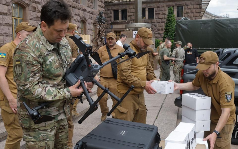 A serviceman checks a drone