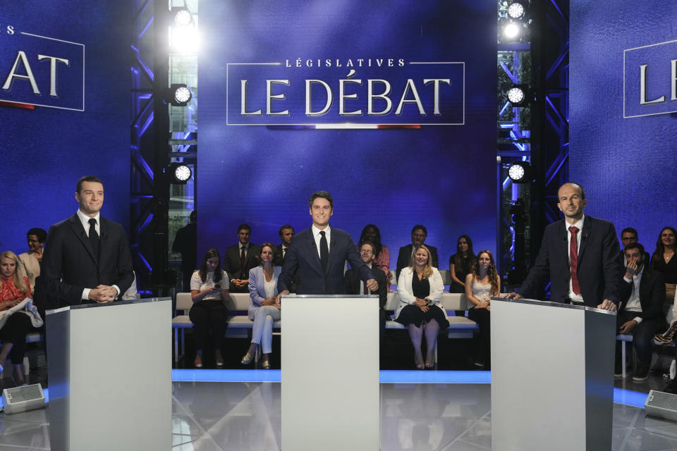 From the left, French far-right Rassemblement National (National Rally) party President Jordan Bardella, French Prime Minister Gabriel Attal and far-left party La France Insoumise (France Unbowed) member Manuel Bompard pose prior to a debate broadcasted on French TV channel TF1, in Boulogne-Billancourt, outside Paris, Tuesday, June 25, 2024. The two-round parliamentary election will take place on June 30 and July 7. (Dimitar Dilkoff, Pool via AP)