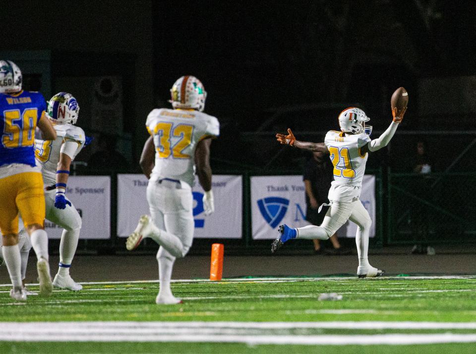 Kelby Tyre of the Gold Team runs for touchdown on an interception against the Blue Team in the Rotary South All Star game at Fort Myers High School on Wednesday, Dec. 13, 2023. The Gold team won in a thriller.
(Credit: Andrew West/The News-Press)