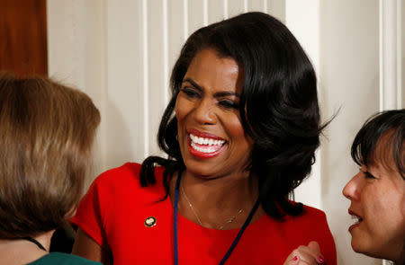 FILE PHOTO: Omarosa Manigault, White House Director of Communications for the Office of Public Liaison, talks with aides prior to a news conference by U.S. President Donald Trump at the White House in Washington, U.S., February 16, 2017. REUTERS/Kevin Lamarque/File Photo