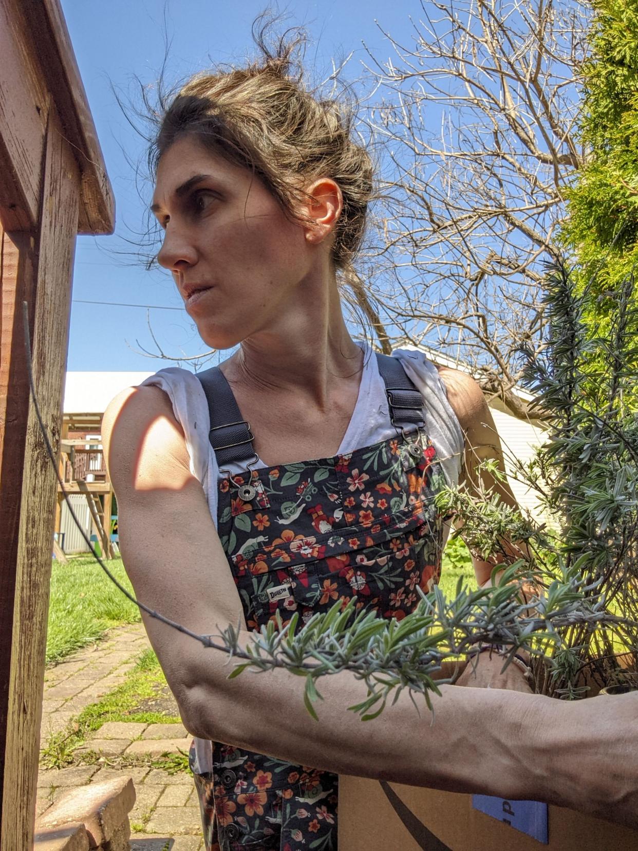 In this staged photo designed to look like an ad for a specific company, Abbey shows off a pair of overalls that remind her to be generous.