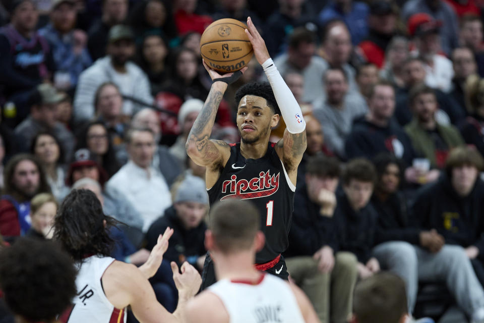 Portland Trail Blazers guard Anfernee Simons shoots a 3-point basket against the Miami Heat during the second half of an NBA basketball game in Portland, Ore., Tuesday, Feb. 27, 2024. (AP Photo/Craig Mitchelldyer)
