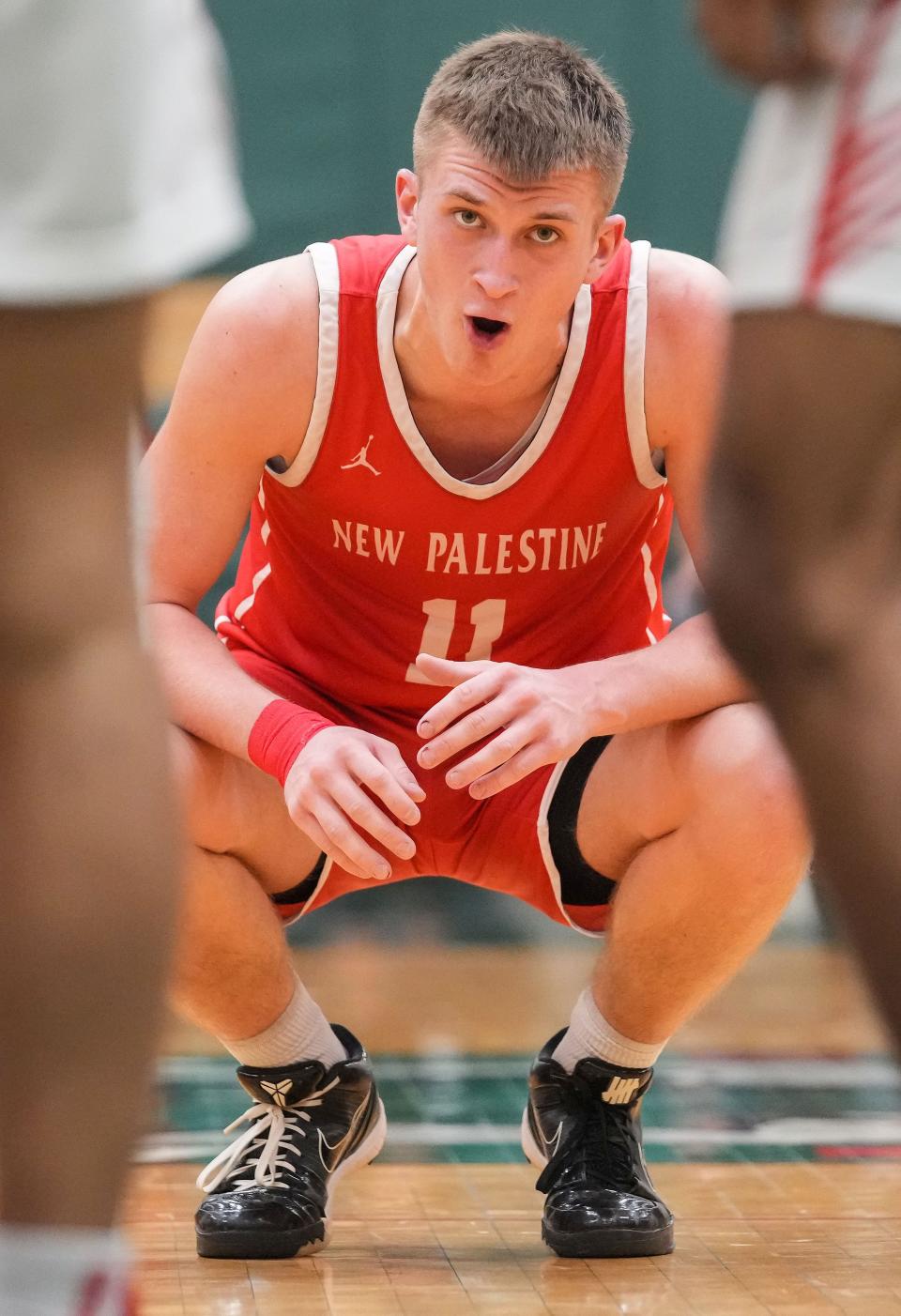 New Palestine Dragons guard Julius Gizzi (11) yells in frustration Wednesday, Jan. 24, 2024, during the game at Lawrence North High School in Indianapolis. The Lawrence North Wildcats defeated the New Palestine Dragons, 57-48.