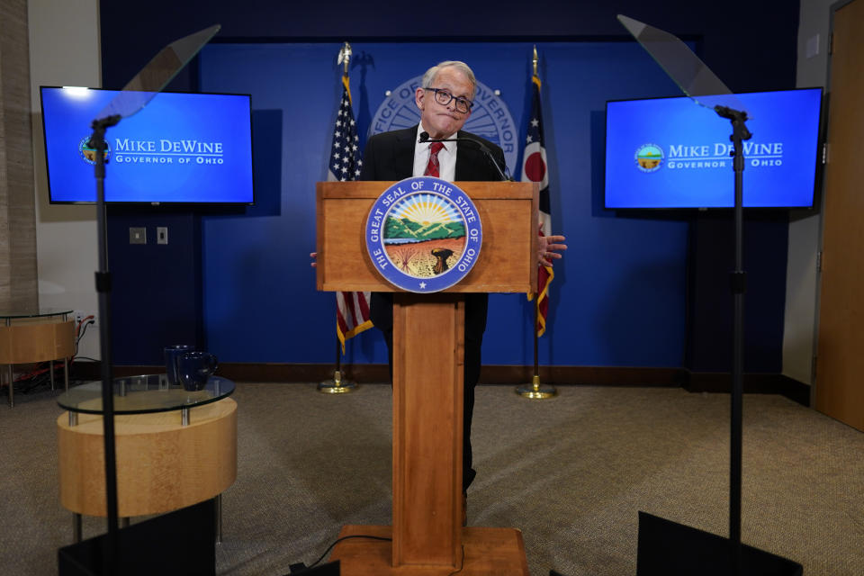 Ohio Gov. Mike DeWine apses as he speaks during a news conference, Friday, Dec. 29, 2023, in Columbus, Ohio. DeWine vetoed a measure Friday that would have banned gender-affirming care for minors and transgender athletes’ participation in girls and women’s sports, in a break from members of his party who championed the legislation. (AP Photo/Carolyn Kaster)