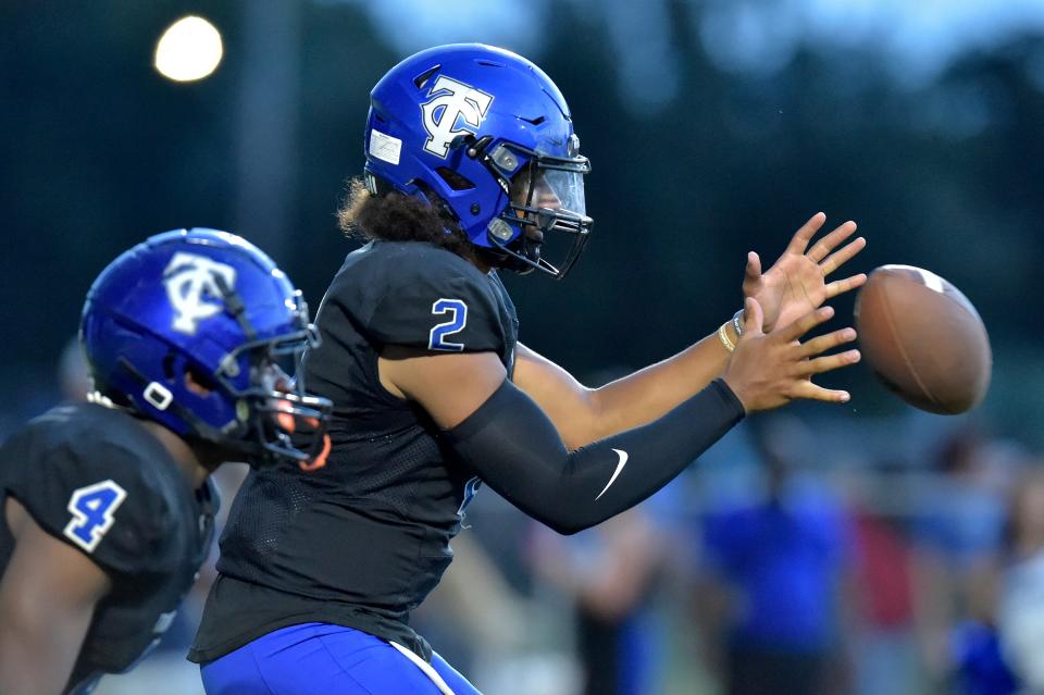 Trinity Christian quarterback Colin Hurley takes a snap. The Super 11 quarterback surpassed 5,000 career yards last week against Providence.